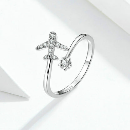 Sterling silver open ring with zircon airplane and flower ends