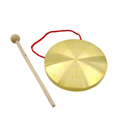 Gold brass hand gong with wooden mallet and red carrying cord