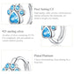 Sterling silver cat paw print hoop earring with blue zircon paw pad stones