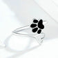 Open paw print ring, thin silver band with black enamel paw