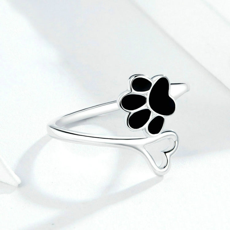 Open paw print ring, thin silver band with black enamel paw