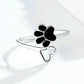 Silver open ring with black paw print enamel and curved band