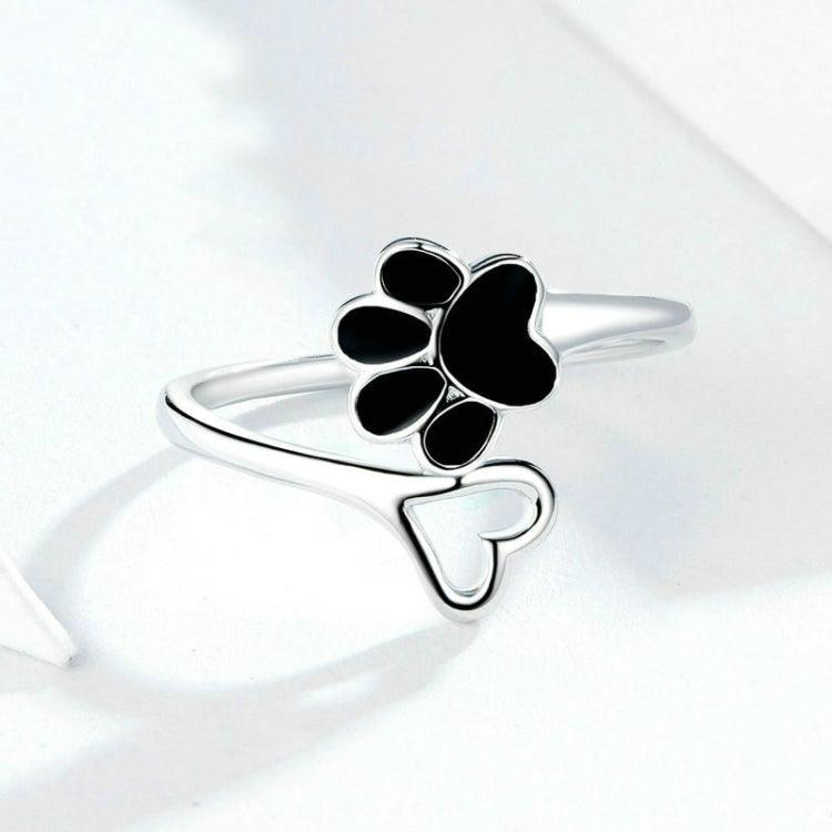 Silver open ring with black paw print enamel and curved band