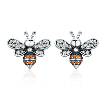 Bee stud earrings in sterling silver with white stones and orange accents