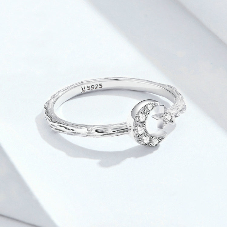 Sterling silver open ring with star and moon zircon detail