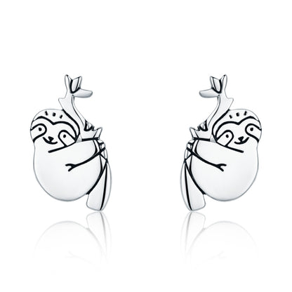 Silver sloth stud earrings, oval face with dotted details and small leaf top
