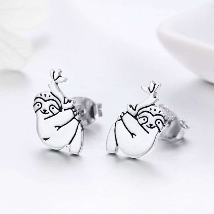 Sterling silver sloth stud earrings with leaf crown, side view showing post and back