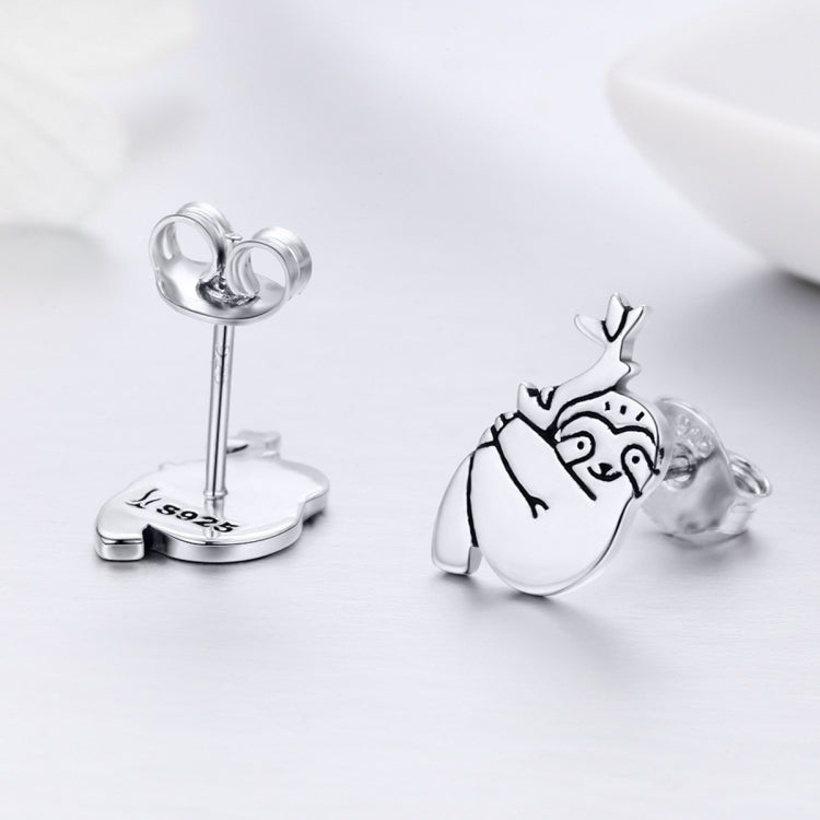 Sterling silver sloth stud earring with butterfly post backing, angled view