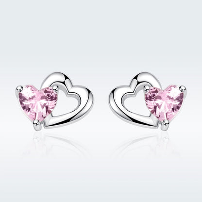 Heart stud earrings in sterling silver with pink gemstone hearts