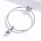 Silver charm bracelet with elephant charm on left and owl charm on right
