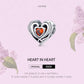 Heart-in-heart charm bead in sterling silver with orange CZ center