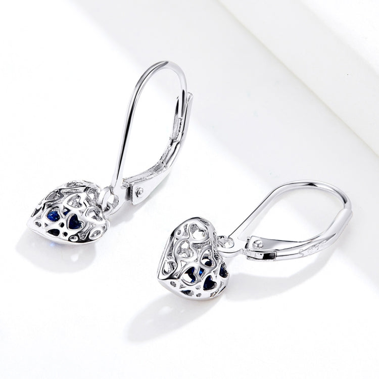 Sterling silver hollow heart earrings with blue accents