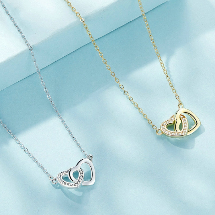 Gold and silver heart pendant necklaces with CZ stones on linked chains