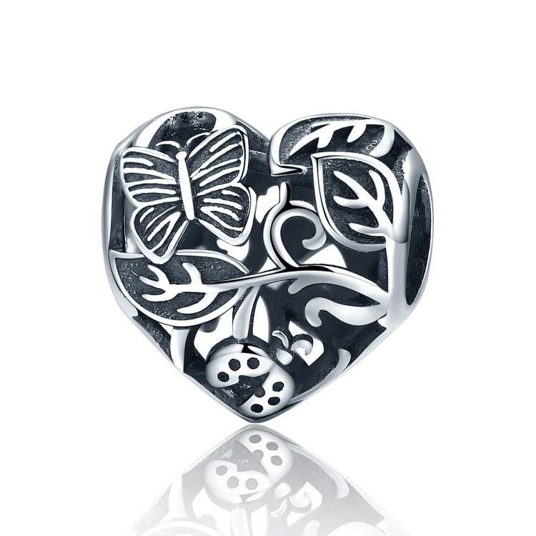 Sterling silver heart charm bead with butterfly and garden motifs, polished details