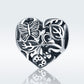 Sterling silver heart charm bead with butterfly, leaf, and flower engravings