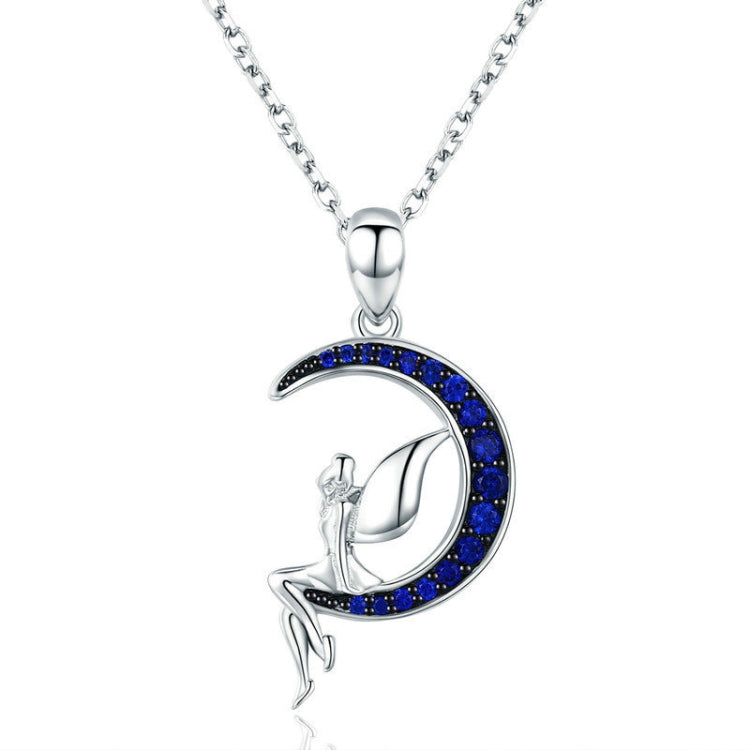 Sterling silver necklace with crescent moon fairy pendant and blue zircon accents