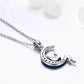 Sterling silver crescent moon pendant with blue CZ stones on a chain