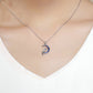 Sterling silver necklace with crescent moon and fairy pendant with blue zircon