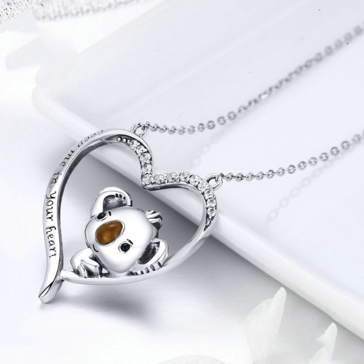 Heart-shaped silver pendant necklace with koala face and CZ-studded rim