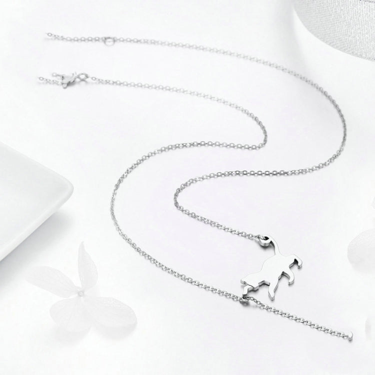 Silver-tone chain necklace with cat silhouette charm and small CZ pendant