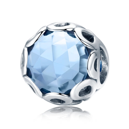 Blue faceted crystal charm bead with silver openwork oval frame