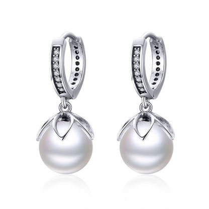 Silver hoop earrings with round shell bead drops and clear stones