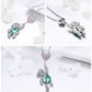 Double-charm necklace: pink heart CZ pendant and silver bear with teal crystal