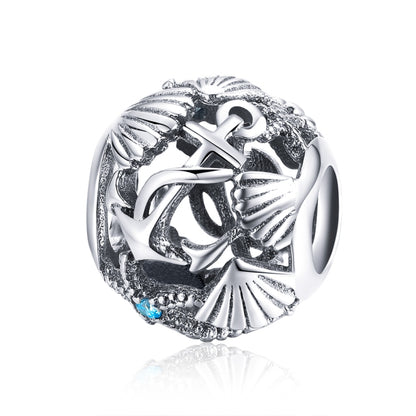 Sterling silver beach theme charm bead with anchor, shells, and blue CZ accents