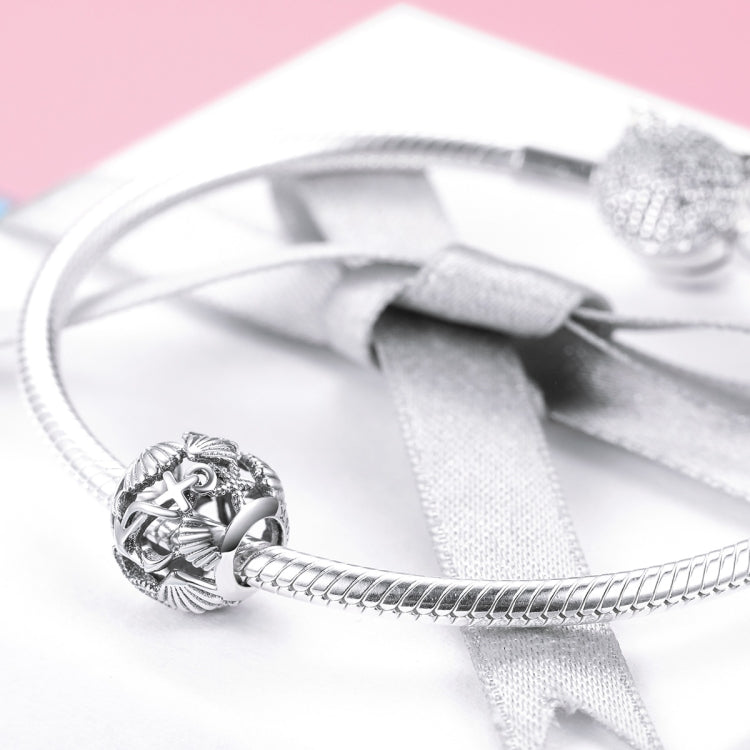 Sterling silver beach charm bead with anchor motif on metal bracelet chain