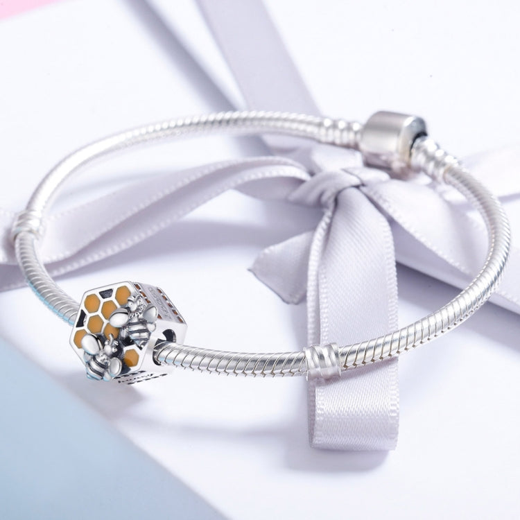 Sterling silver charm bead on bracelet with snake chain and white ribbon