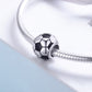 Close-up of soccer ball charm bead with black enamel on silver bracelet chain