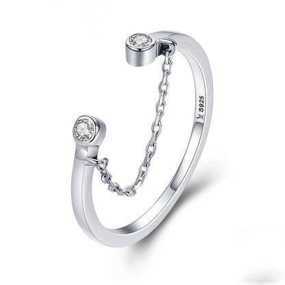 Silver open ring with bezel-set round CZ stones and linked chain detail, S925 look