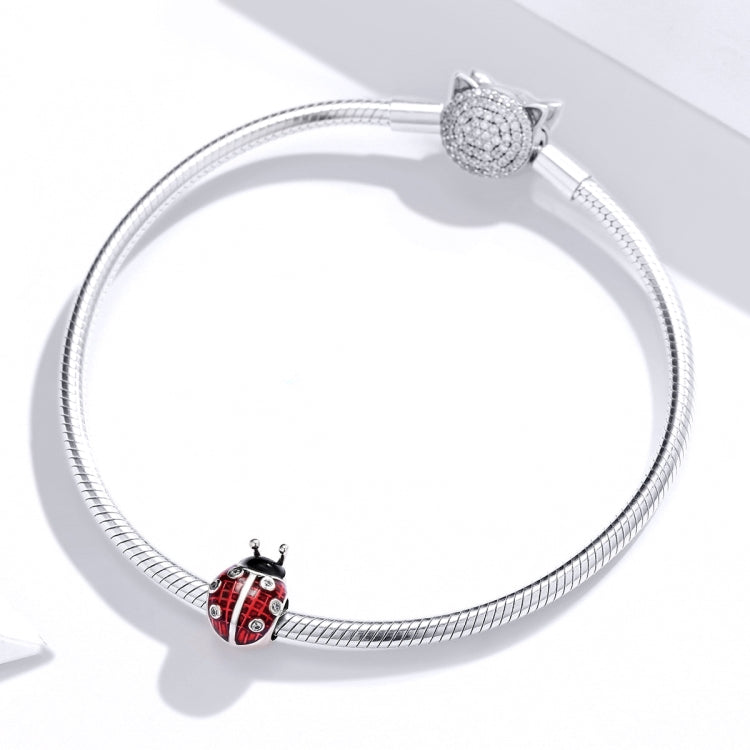 Ladybug charm bead on silver snake chain bracelet with oxidized silver details