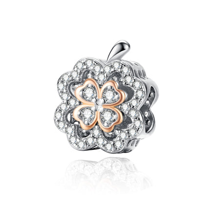 Sterling silver four-leaf clover zircon charm bead with rose gold accents