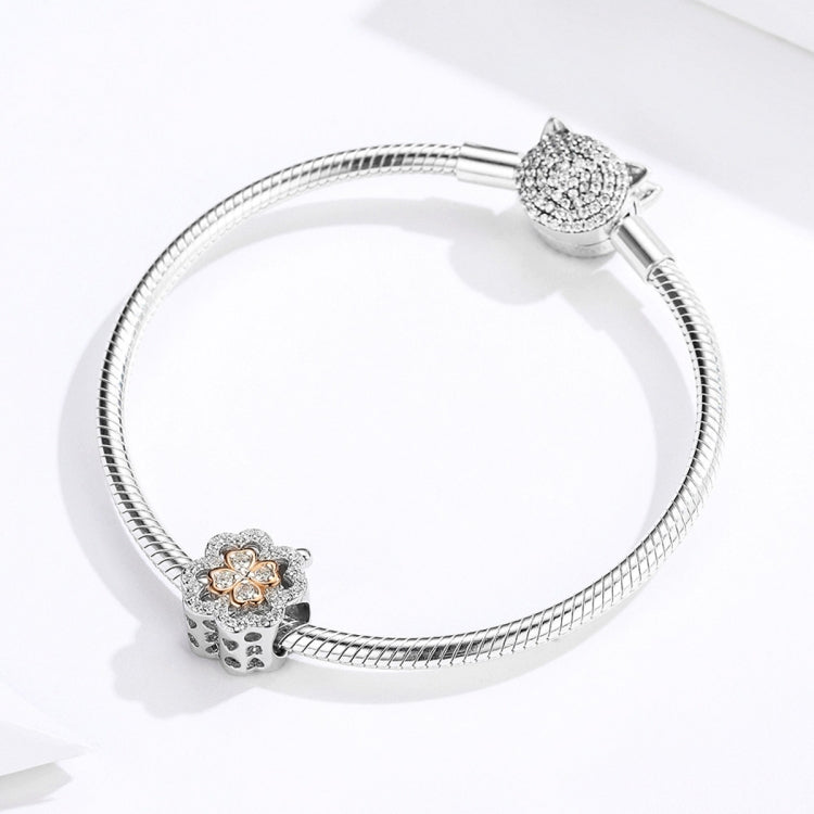 Sterling silver charm bracelet with four-leaf clover bead and pavé clasp