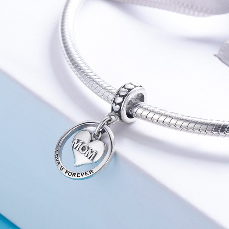 Sterling silver round "MOM" heart charm on a coiled snake chain with heart motif