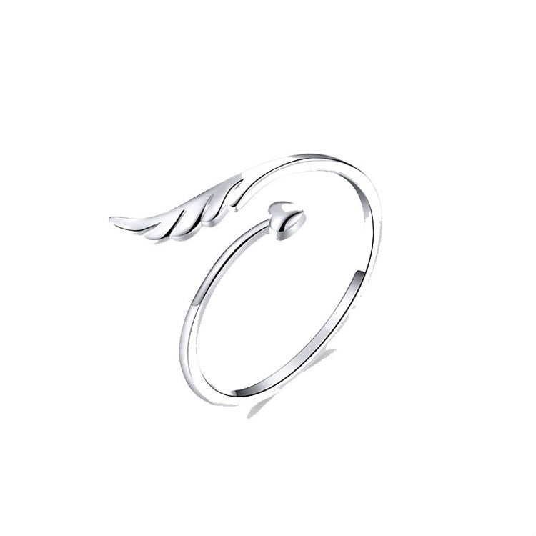 Silver open ring with angel wings motif, white gold plated look