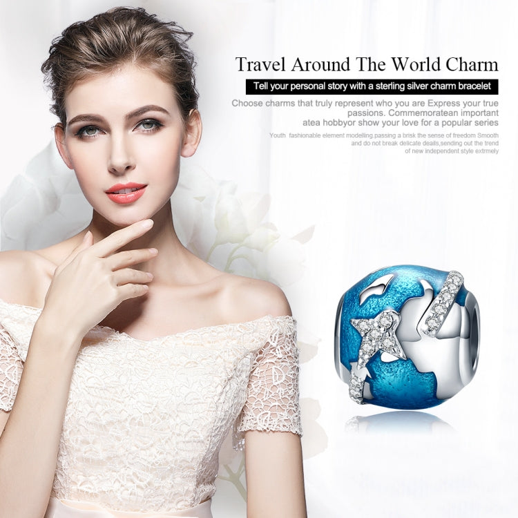 Sterling silver globe charm bead with blue enamel and sparkling airplane and star accents