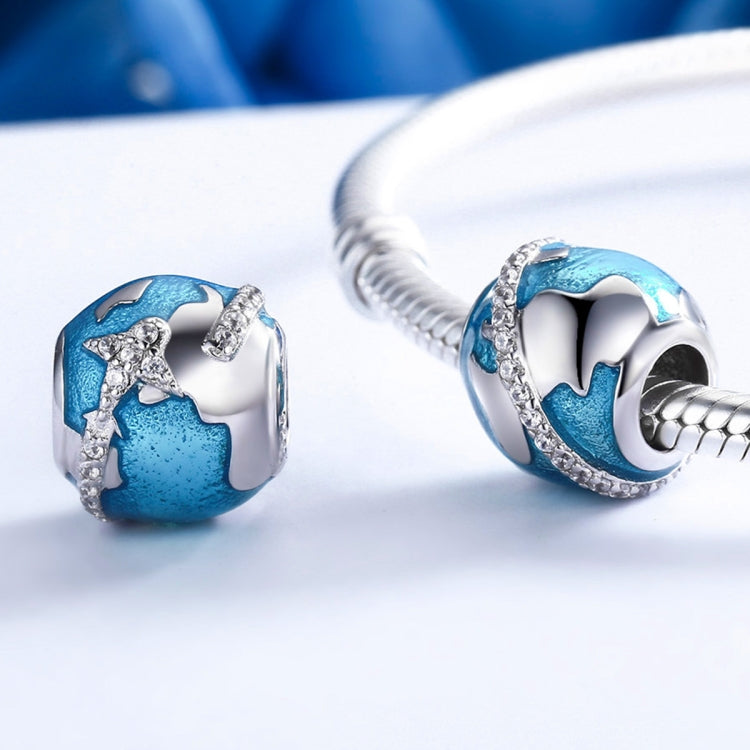 Sterling silver globe bead with blue enamel and clear stones on bracelet