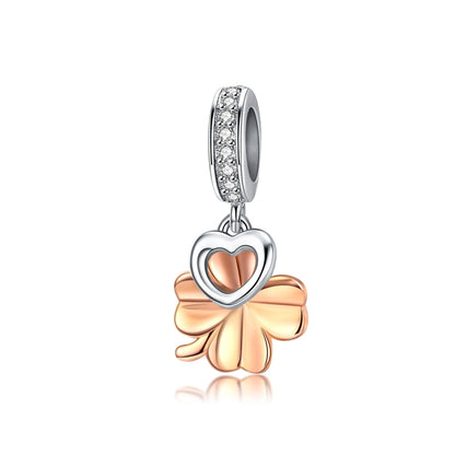 Sterling silver clover charm with rose-gold petals and heart center, CZ accents