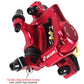 Red hydraulic disc brake caliper close-up with adjustment screw area and mounting points
