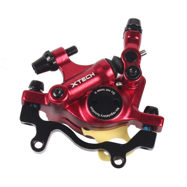 Red hydraulic disc brake caliper with mounting bolts and hose port