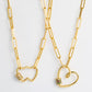 Gold-tone double heart pendant necklace with multicolor zircon accents and chain links