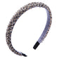 Gray crystal beaded fabric headband with dark fabric tips and a curved shape