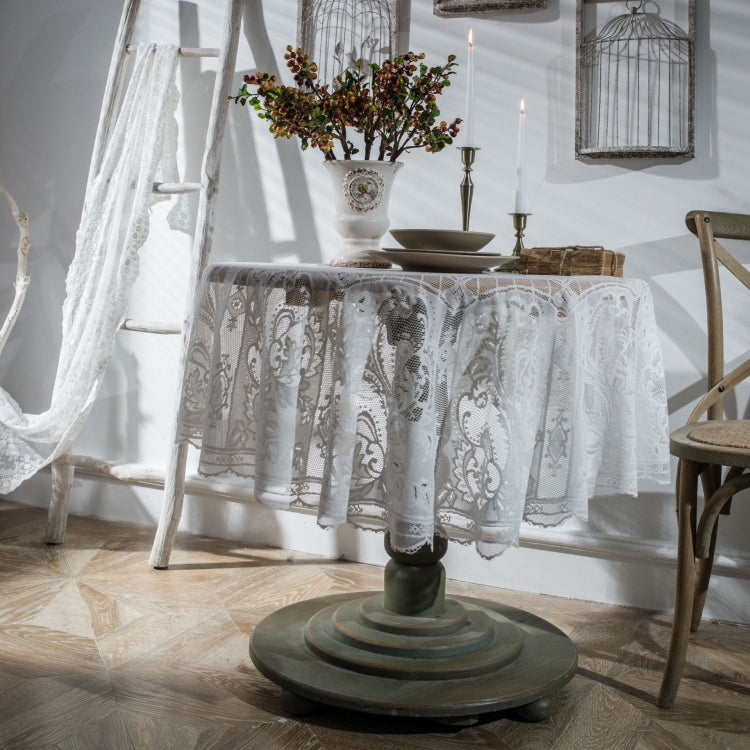 White round lace tablecloth with scalloped edge, ornate floral pattern