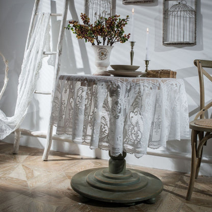 White round lace tablecloth with scalloped edge, ornate floral pattern