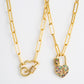Two gold-tone chain necklaces with heart lock pendants, multicolor zircon stones