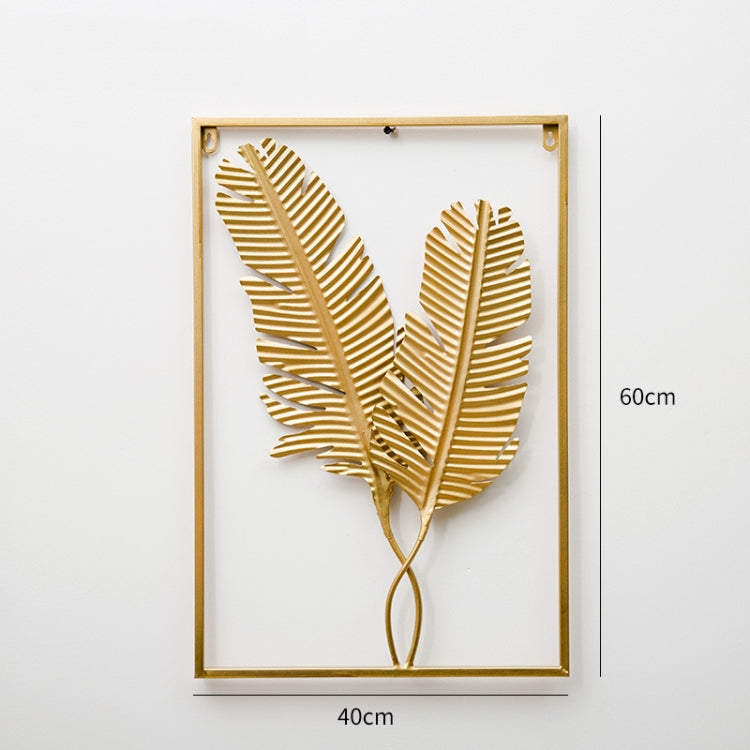 Gold metal leaf wall hanging in rectangular frame with botanical fan leaves and stem