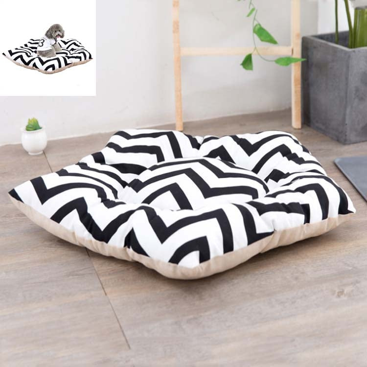 Small pet sleeping mat bed with black-and-white zigzag cover and light beige base