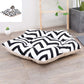 Small dog sleeping mat bed with black-and-white zigzag fabric and cream cushion border